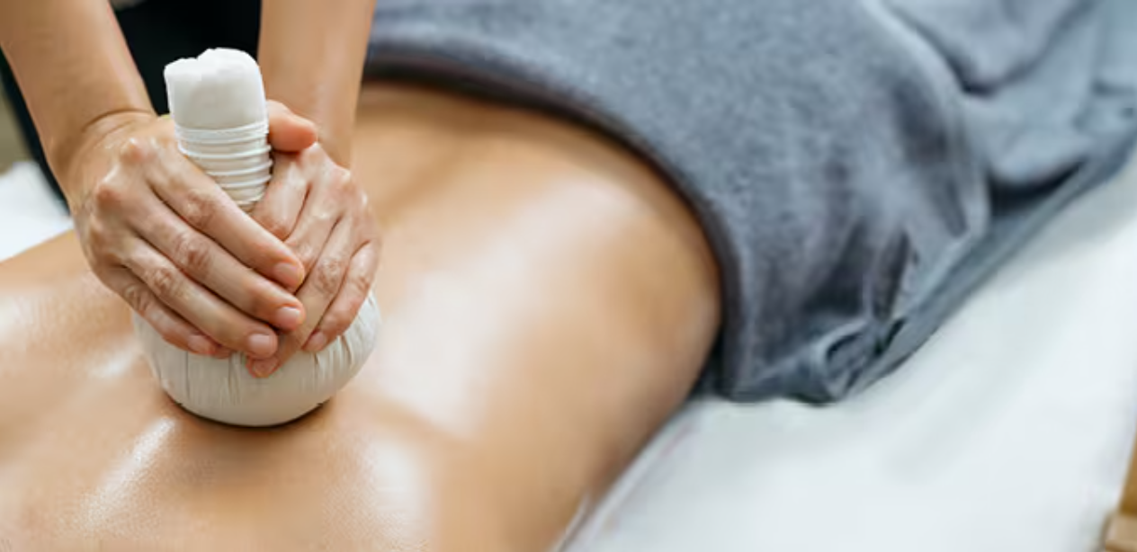 Thai herbal poultice massage