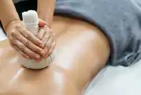 Thai herbal poultice massage